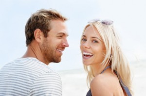 A couple enjoys smiling with dental implants